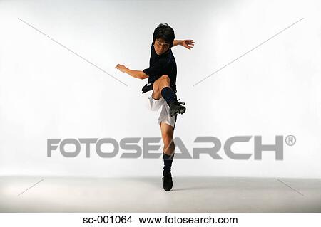 Picture - Soccer player shooting. Fotosearch