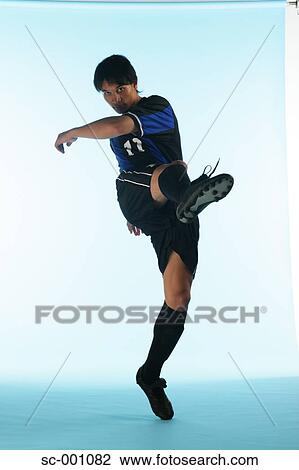 Stock Image - Soccer player shooting. Fotosearch