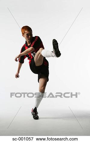 Stock Photo - Soccer player shooting. Fotosearch