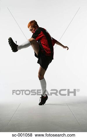 Stock Photo - Soccer player shooting. Fotosearch