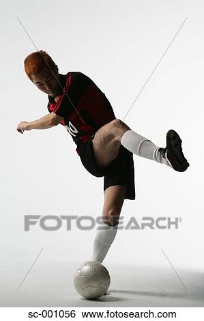 Stock Photograph - Soccer player shooting. Fotosearch