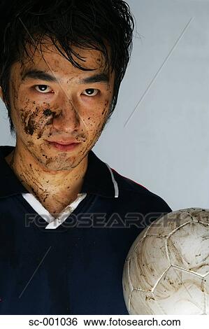 Soccer player with face covered in mud View Large Photo Image Stock Photograph - Soccer player with face covered in mud. Fotosearch