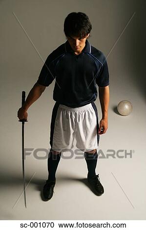 Soccer player with Japanese sword View Large Photo Image Stock Image - Soccer player with Japanese sword. Fotosearch