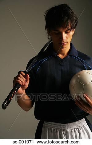 Stock Image - Soccer player with Japanese sword. Fotosearch