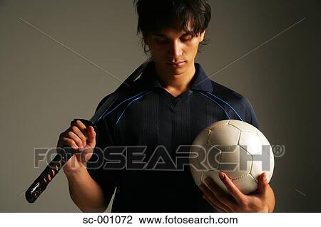 Stock Image - Soccer player with Japanese sword. Fotosearch