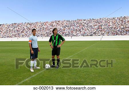 Opposing captains posing with ball View Large Photo Image Stock Image - Opposing captains posing with ball. Fotosearch