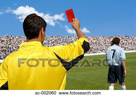 Referee showing red card to disappointed player View Large Photo Image Stock Image - Referee showing red card to disappointed player. Fotosearch