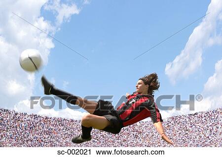 Soccer player doing scissor-kick View Large Photo Image Stock Image - Soccer player doing scissor-kick. Fotosearch
