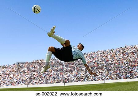 Soccer player doing scissor-kick View Large Photo Image Stock Image - Soccer player doing scissor-kick. Fotosearch