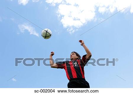 Soccer player heading ball View Large Photo Image Picture - Soccer player heading ball. Fotosearch