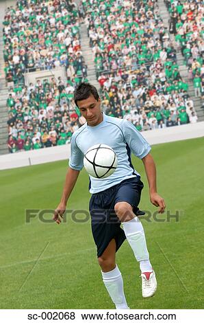 Soccer player juggling ball View Large Photo Image Stock Photo - Soccer player juggling ball. Fotosearch
