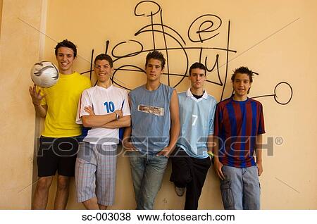 Group of teenage soccer friends against wall View Large Photo Image Stock Photo - Group of teenage soccer friends against wall. Fotosearch