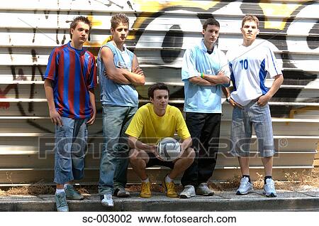 Stock Image - Group of teenage soccer friends. Fotosearch