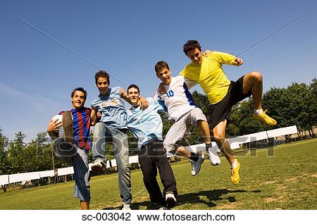 Stock Image - Group of teenage soccer friends. Fotosearch