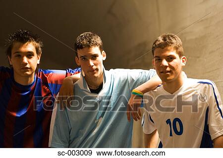 Stock Photo - Group of teenage soccer friends. Fotosearch