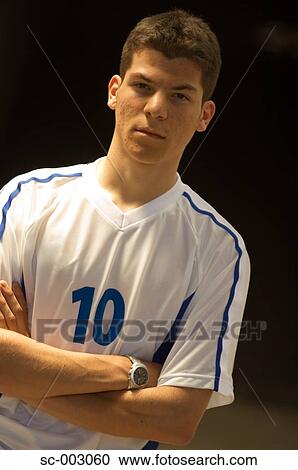 Stock Image - Portrait of teenage boy in soccer shirt. Fotosearch