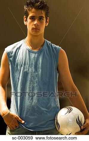 Portrait of teenage boy with soccer ball View Large Photo Image Stock Photo - Portrait of teenage boy with soccer ball. Fotosearch