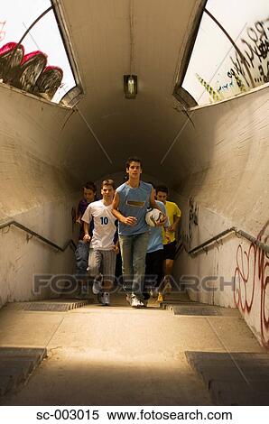 Street soccer team emerging from tunnel View Large Photo Image Stock Photography - Street soccer team emerging from tunnel. Fotosearch