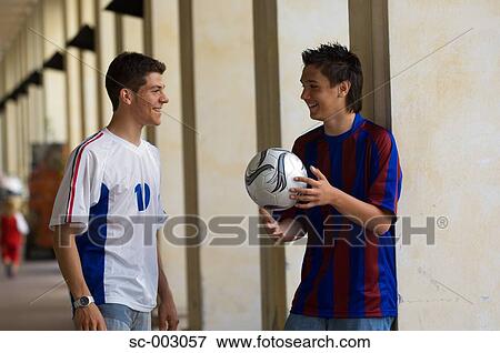 Teenage boys chatting in town View Large Photo Image Stock Photo - Teenage boys chatting in town. Fotosearch