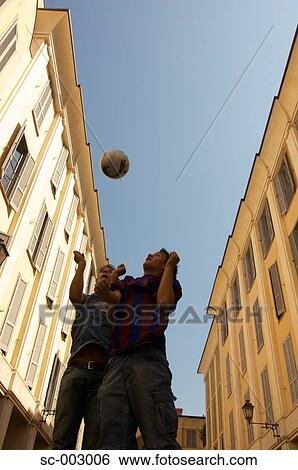 Teenage boys heading soccer ball View Large Photo Image Stock Photograph - Teenage boys heading soccer ball. Fotosearch