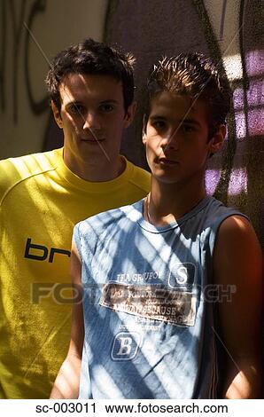 Stock Image - Teenage boys in shadows. Fotosearch