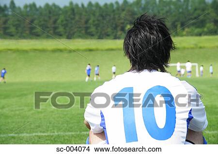 Back of soccer player watching game from side View Large Photo Image Picture - Back of soccer player watching game from side. Fotosearch