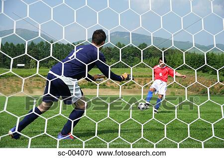 Penalty scene from behind goalnet View Large Photo Image Stock Image - Penalty scene from behind goalnet. Fotosearch