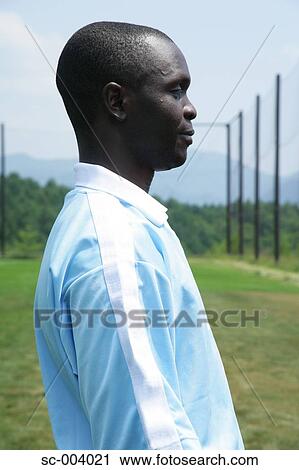 Stock Image - Side view of soccer player. Fotosearch