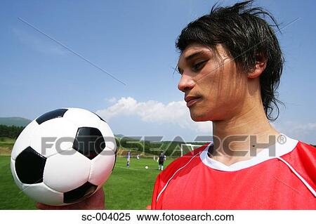 Soccer player looking at ball View Large Photo Image Stock Photography - Soccer player looking at ball. Fotosearch