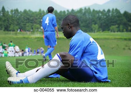 Stock Photography - Soccer player preparing on sideline. Fotosearch