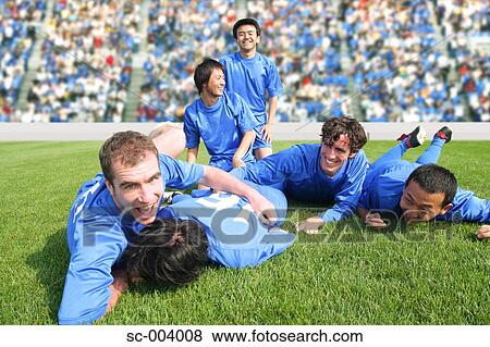 Stock Photo - Soccer team celebrating. Fotosearch