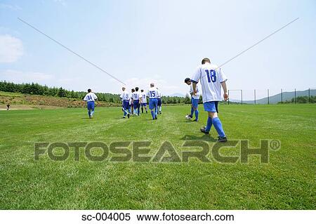 Stock Photography - Soccer team walking out onto pitch. Fotosearch