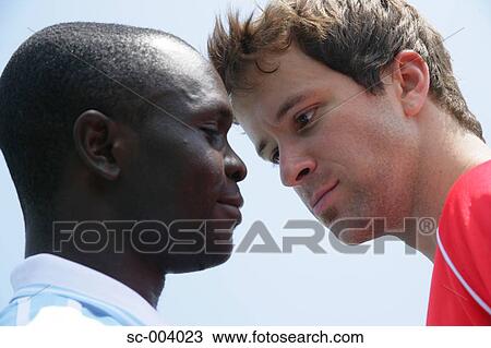 Stock Image - Two players from rival teams face off. Fotosearch