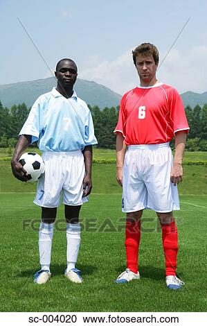 Stock Image - Two players from rival teams. Fotosearch