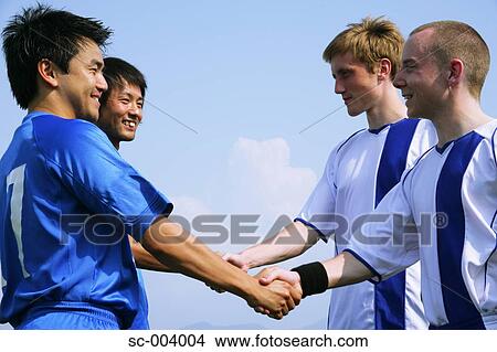 Two soccer teams shake hands View Large Photo Image Picture - Two soccer teams shake hands. Fotosearch