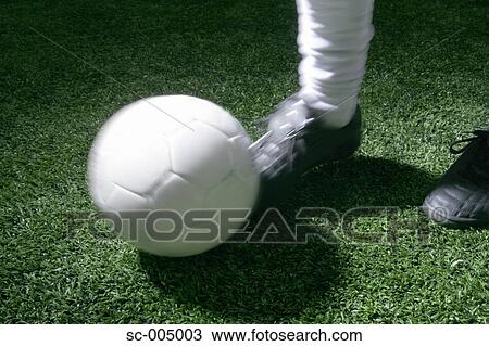 Close-up of foot kicking soccer ball View Large Photo Image Stock Image - Close-up of foot kicking soccer ball. Fotosearch