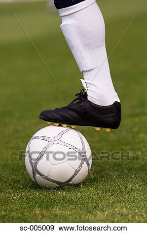 Close-up of foot on soccer ball View Large Photo Image Stock Photo - Close-up of foot on soccer ball. Fotosearch