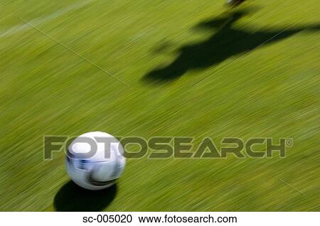 Shadow of soccer player running with ball View Large Photo Image Stock Image - Shadow of soccer player running with ball. Fotosearch