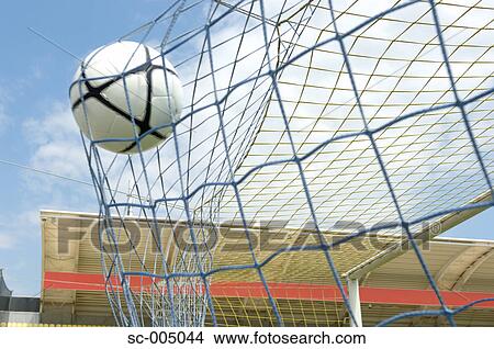 Picture - Soccer ball hitting back of net. Fotosearch