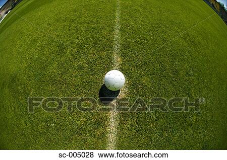 Stock Photo - Soccer ball on centre spot. Fotosearch