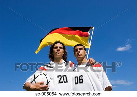 Two soccer friends wearing 2006 on their shirts with German flag View Large Photo Image Picture - Two soccer friends wearing 2006 on their shirts with German flag. Fotosearch