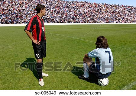 Two soccer players waiting on pitch View Large Photo Image Stock Photo - Two soccer players waiting on pitch. Fotosearch
