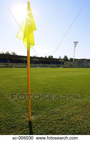 Stock Image - View of soccer pitch from behind corner flag. Fotosearch