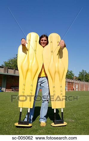Stock Image - Young man with two soccer dummies. Fotosearch
