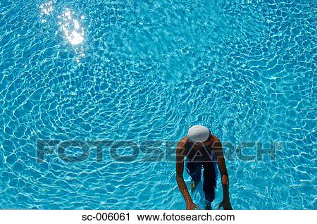 Stock Image - Bird's Eye View of Female Swimmer In Pool. Fotosearch