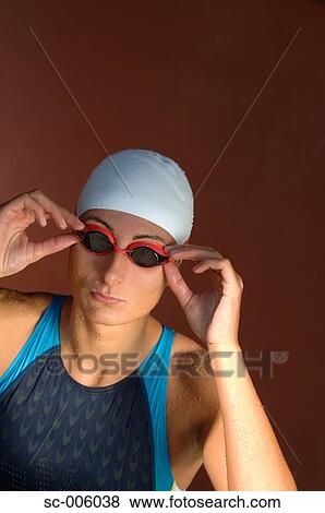 Female Swimmer Adjusting Goggles View Large Photo Image Stock Photo - Female Swimmer Adjusting Goggles. Fotosearch