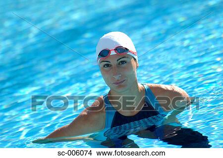 Picture - Female Swimmer Floating in Pool. Fotosearch