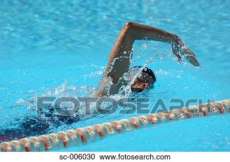 Stock Image - Female Swimmer Swimming Crawl. Fotosearch