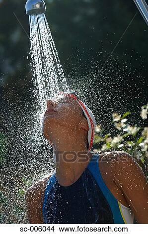 Picture - Female Swimmer Taking a Shower. Fotosearch