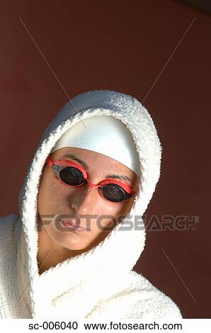 Stock Image - Female Swimmer Wrapped in Towels. Fotosearch